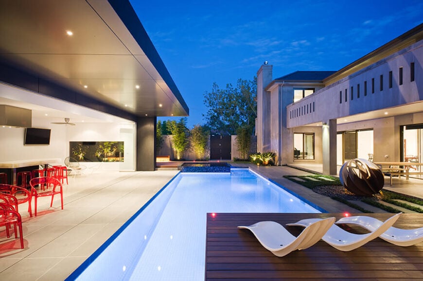 Viewing down the length of the pool, we see the intricate lighting scheme that places dozens of small recessed light sources throughout the interior, exterior, and within the pool itself.