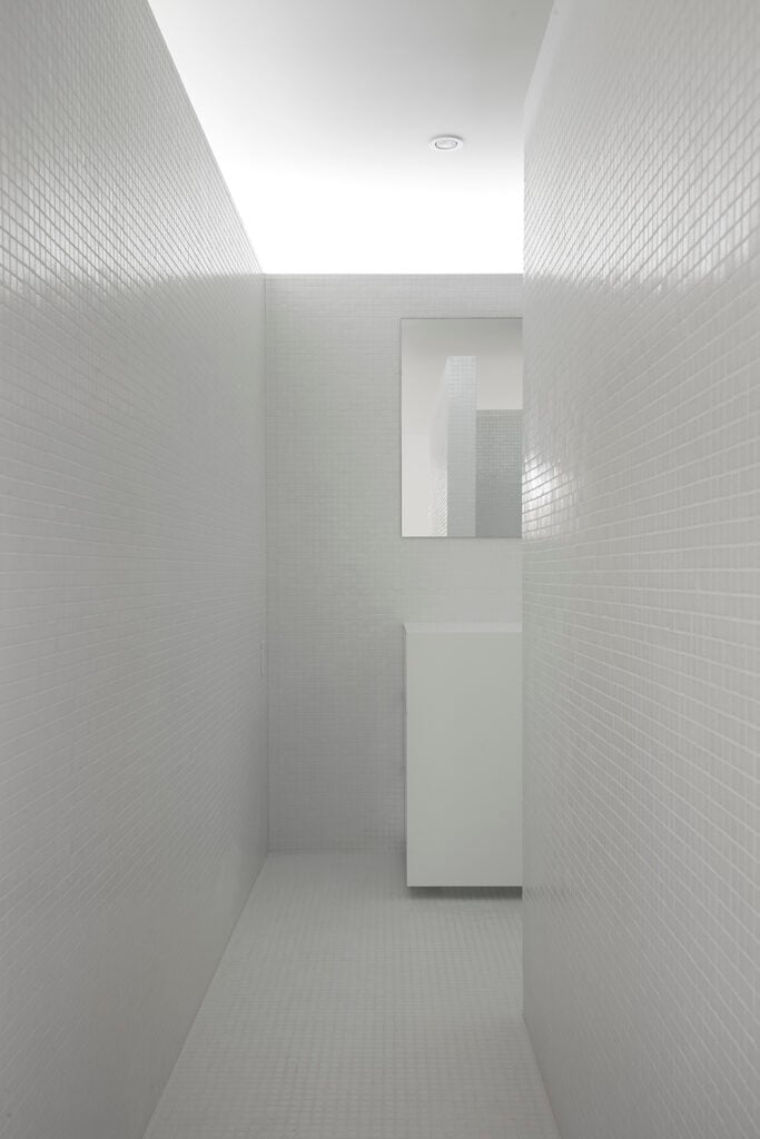 This view from the bathroom entrance displays that even when standing directly before the entrance of the bathroom, the configuration of walls provides sufficient privacy.