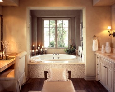 Mediterranean bathroom design with luxurious bathing alcove.
