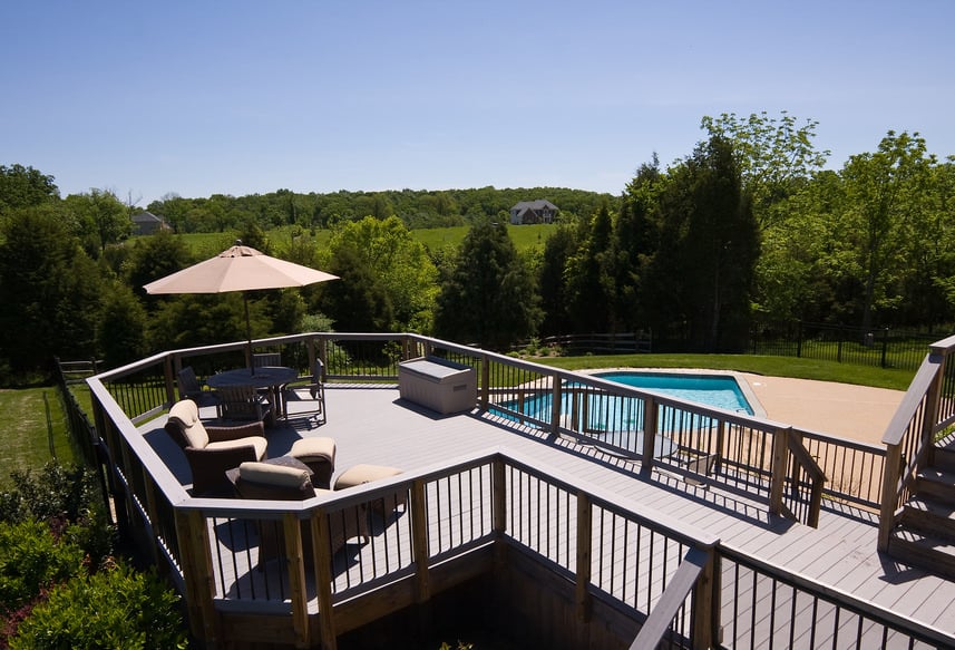 This deck offers a couple of comfortable chairs with footrests and a shaded small dining table set. Also it overlooks the stylish pool and the beautiful nature surrounding the area.