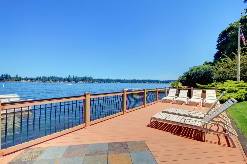 This deck offers a set of lounger seats overlooking the beautiful wide river mirroring the blue skies.
