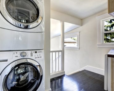 Small laundry room closet on landing.