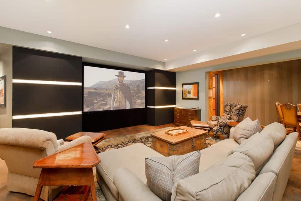 A contemporary media room looking cozy and warm with this brown and orange color combination.