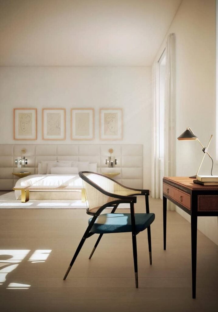 A classy master bedroom featuring a lovely bed setup with four attractive wall decors along with a study desk on the side.