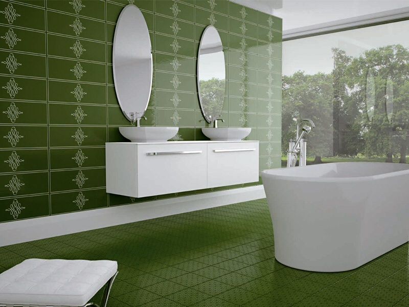 Olive green bathroom features a floating vanity with dual vessel sink mounted on the patterned tiles wall.
