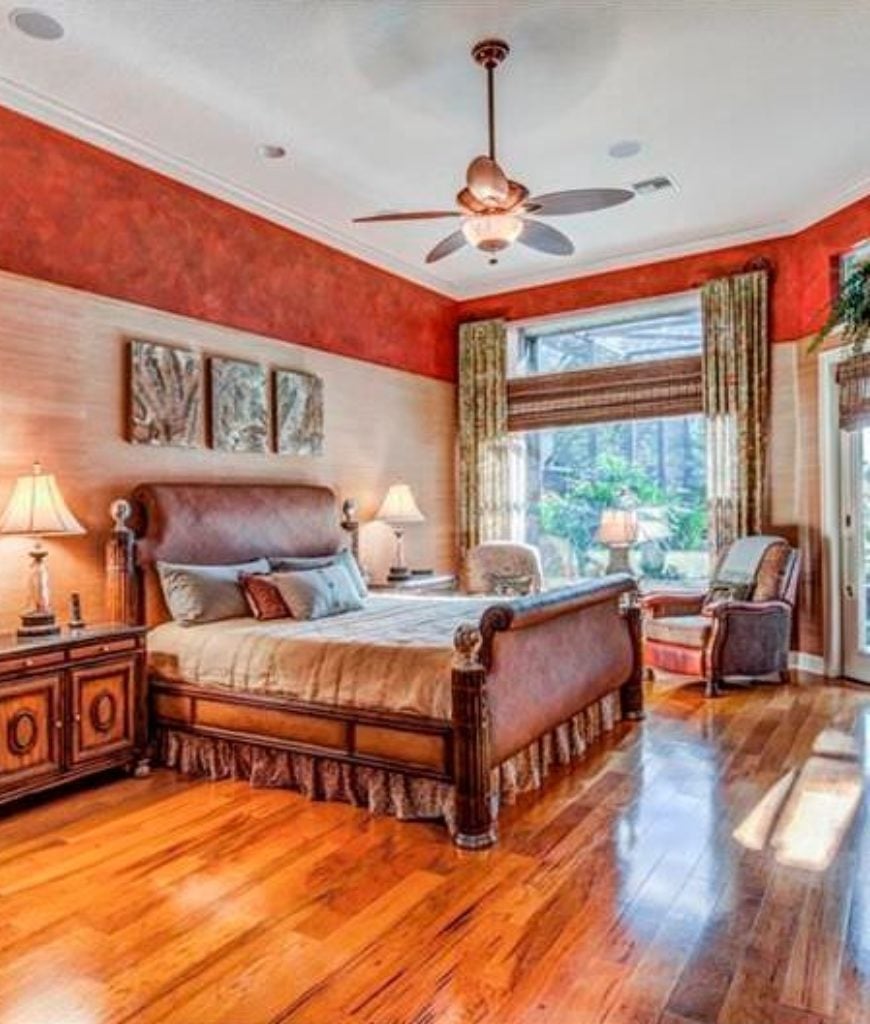 20 Red Master Bedroom Ideas For 2019 Traditional Master Bedroom With Ceiling Fan Light Red Interior Wallpaper And A Cozy Seating Area