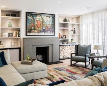 Contemporary formal living room with stylish rug and built-in shelves along with a fireplace and wall decor. Photo credit: Photography / Styling : Rick Mccullagh / LLI Design