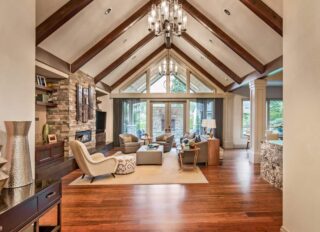Living room with cathedral wood-beamed ceiling