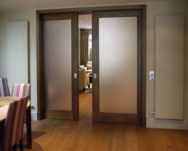 Vintage-type pocket door with frosted glass.