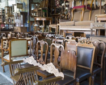 A display of second hand, wooden furniture.