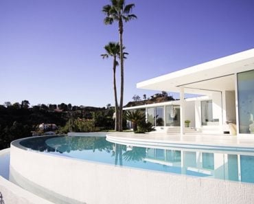 Another outside view of the house featuring its beautiful white architecture. Photo Credit: Gerhard Heusch