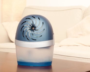 Small dehumidifier with a frosted blue finish.