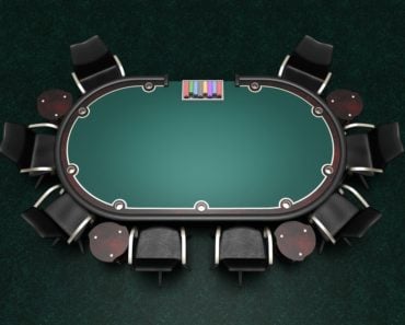 Card table with green surface for playing poker.