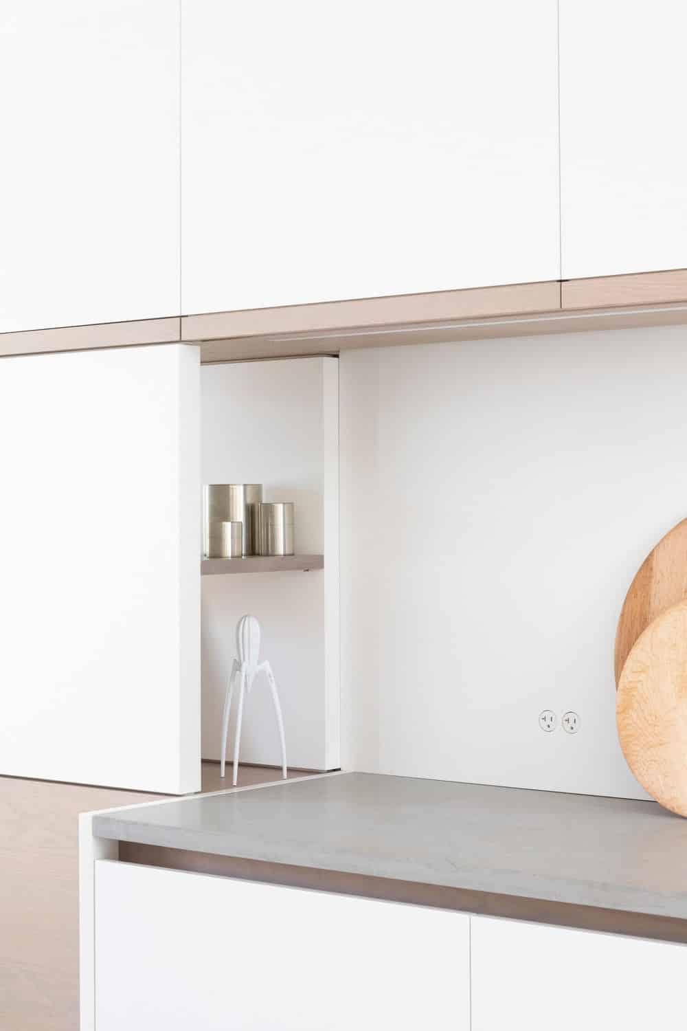 Focused shot at the kitchen's counter and cabinetry. Photo credit: Ema Peter