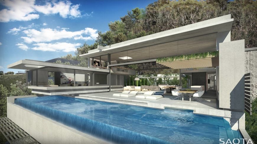 This infinity pool looks so glamorous. The white home perfectly fits with it.