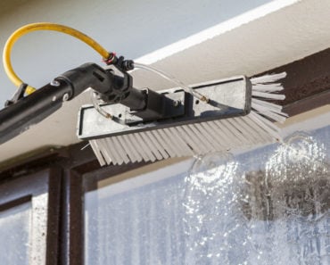 Window washing bruch with hose attachment