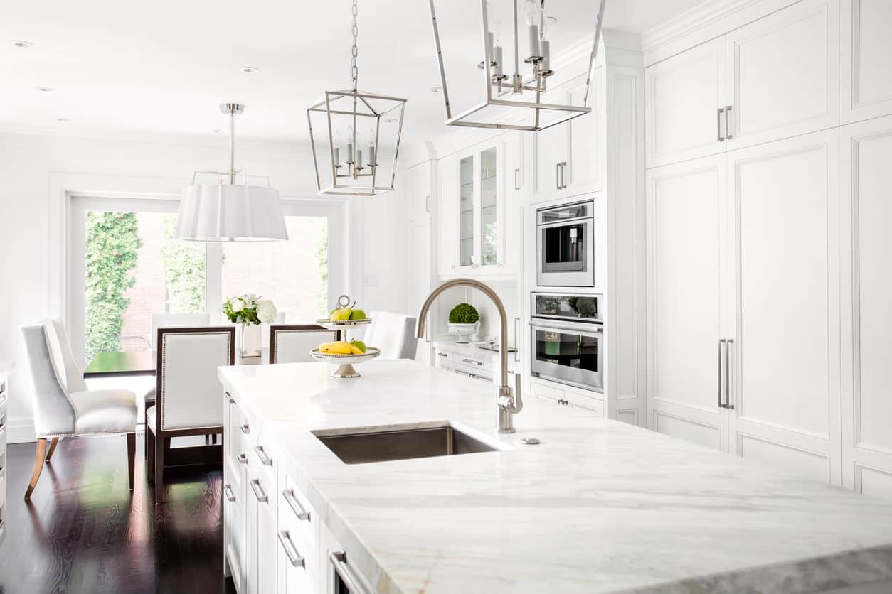 Custom white kitchen with elegant kitchen dining table