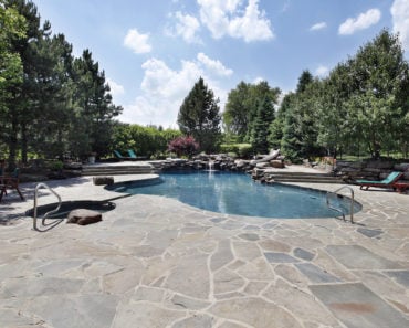 Swimming pool with large flagstone patio