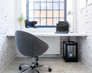 Small white home office with window