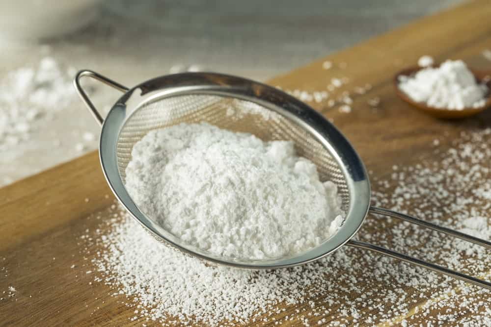 Powdered sugar in a sifter