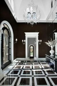 This glamorous grand foyer is drowning in high-gloss elegance. The black and white floors and walls combine perfectly together to create a stunning design.
