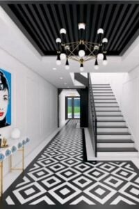 Long foyer featuring a jaw-dropping flooring style. The white walls look beautiful together with the black shade all over the space. The combination of white and black chandelier looks absolutely perfect.