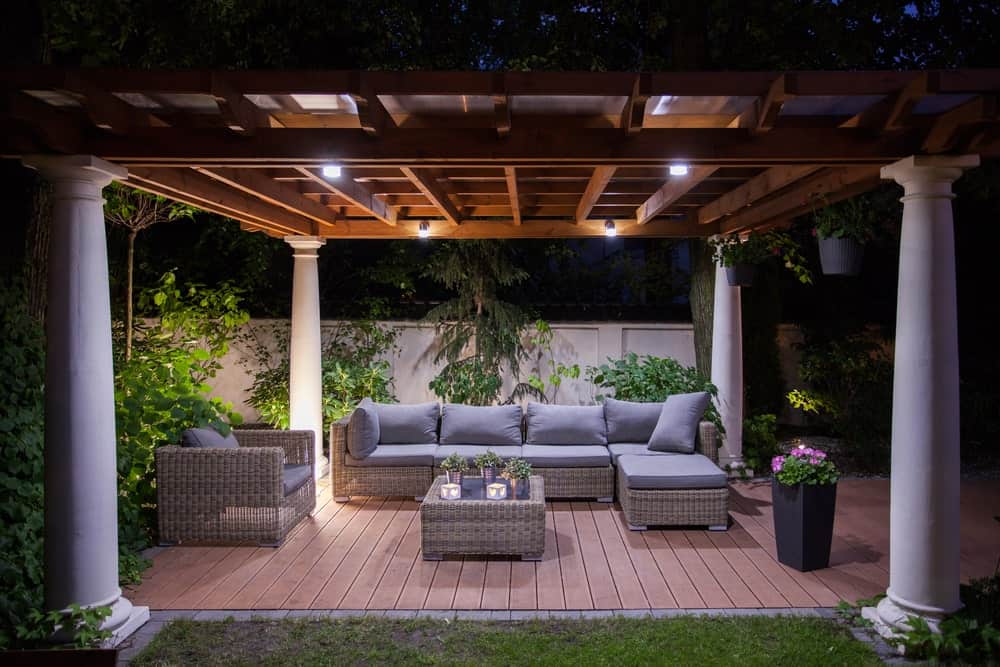 Modern deck featuring rattan sofa set with cushion seats and foam backrests.