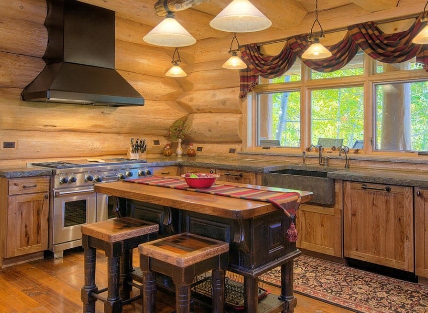 Classy kitchen with rustic finish all over the place. The warm white lights look perfect together with the rustic style of the area.