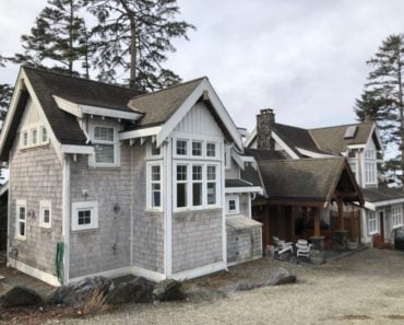This vacation rental beach house is 2 separate houses on the beach joined together by a large hall.