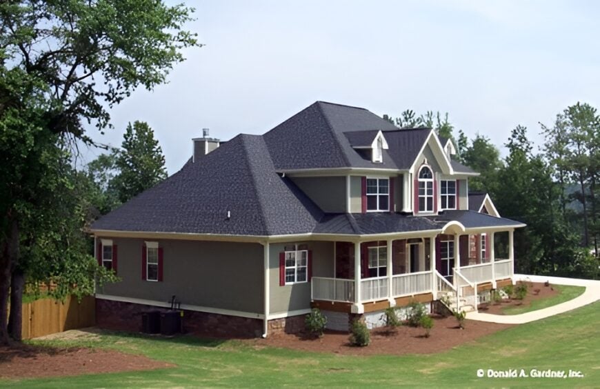 Left exterior view showing the horizontal siding along with red shuttered windows.