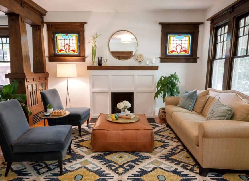 Artsy living room accented with wood elements that match the hardwood flooring and topped by an eye-catching patterned rug. It has a beige sectional contrasted with black upholstered chairs and a square ottoman that serves as the center table.Artsy living room accented with wood elements that match the hardwood flooring and topped by an eye-catching patterned rug. It has a beige sectional contrasted with black upholstered chairs and a square ottoman that serves as the center table.Artsy living room accented with wood elements that match the hardwood flooring and topped by an eye-catching patterned rug. It has a beige sectional contrasted with black upholstered chairs and a square ottoman that serves as the center table.