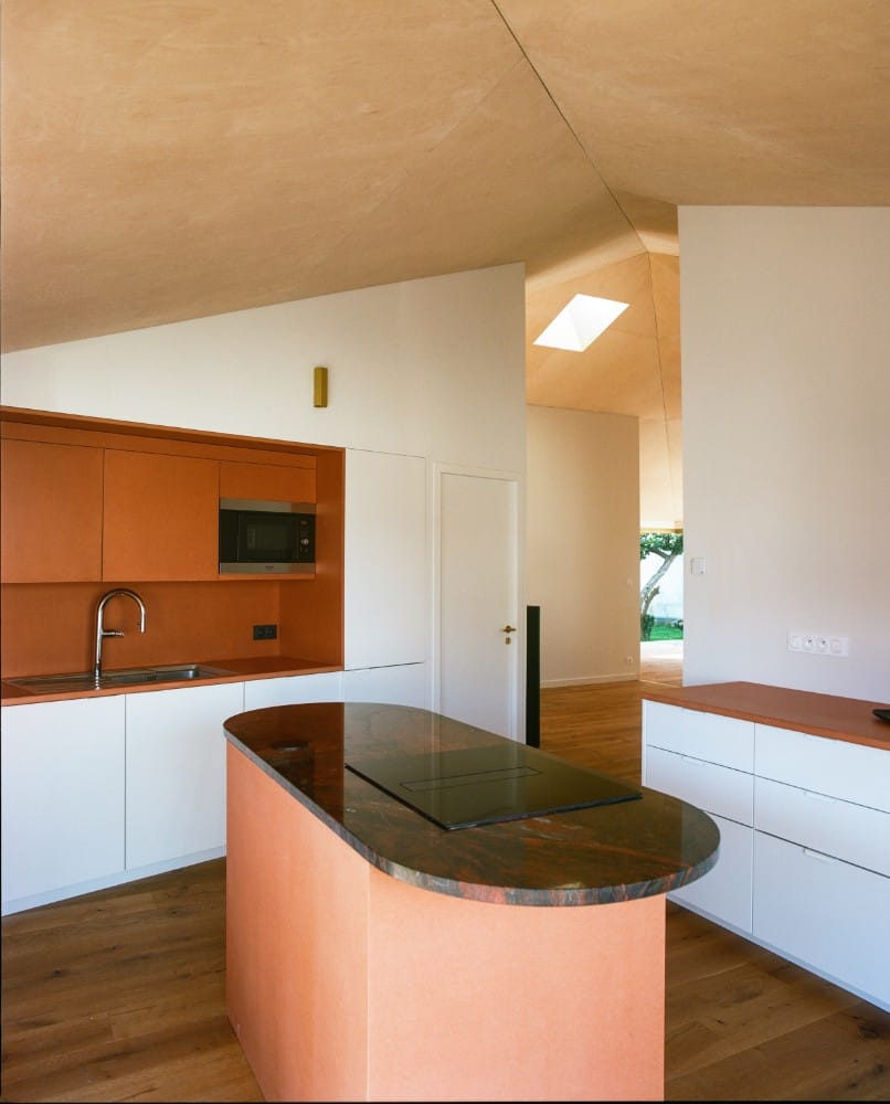 A kitchen with granite countertop.
