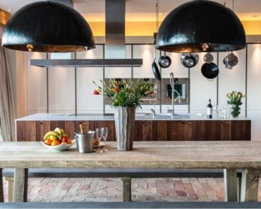 Rustic modern kitchen with terracotta brick flooring.