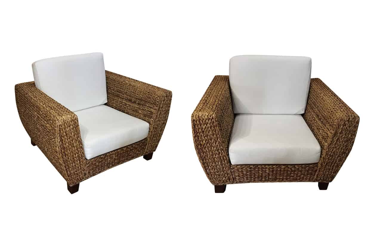 2 wicker chairs with white cushions