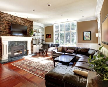 Family room with large leather sectional sofa