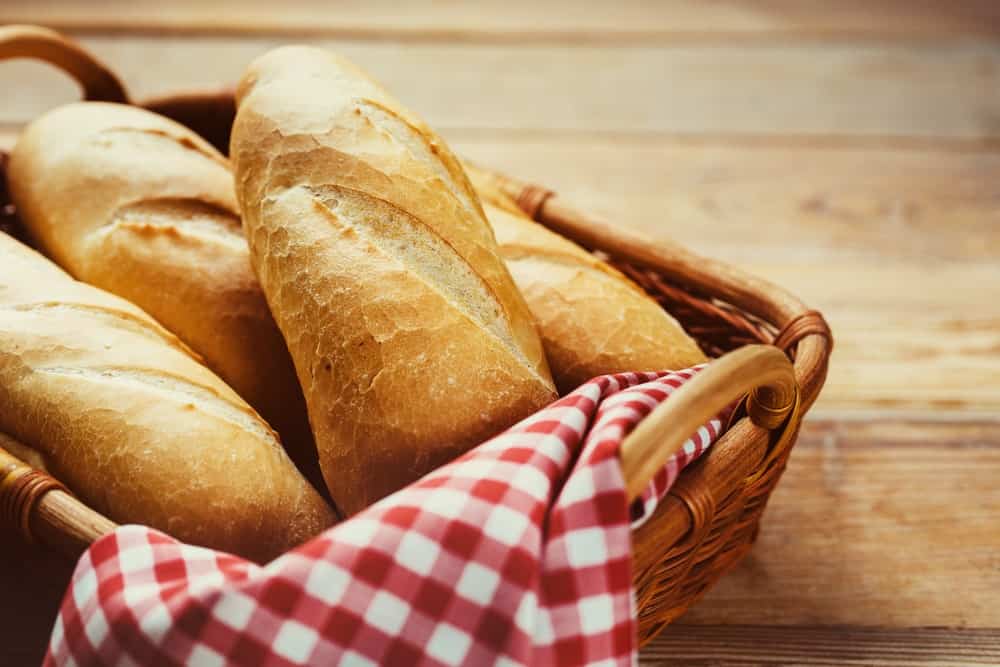 A basket of fresh loaves of bread.