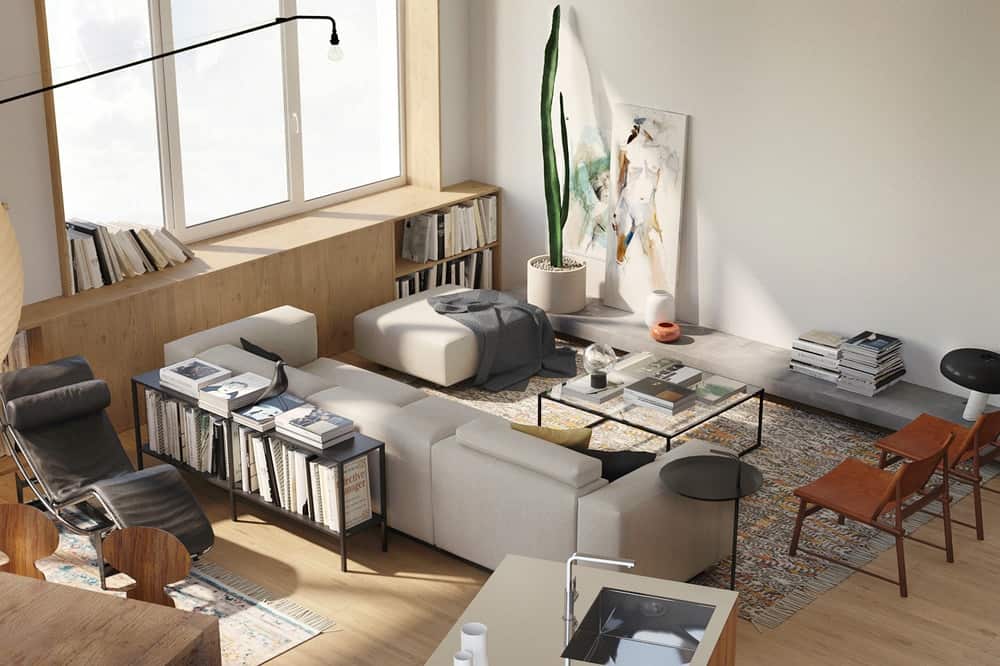This is a full view of the living room area at the far corner of the room with a large gray sofa adorned with various artworks and decors along with a glass-top coffee table.