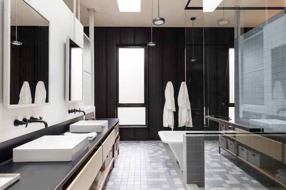 The modern bathroom, which is just a taste of this cool, peaceful rural home. It’s an eclectic mix of materials and colors throughout. There’s light wood, metal, and concrete.