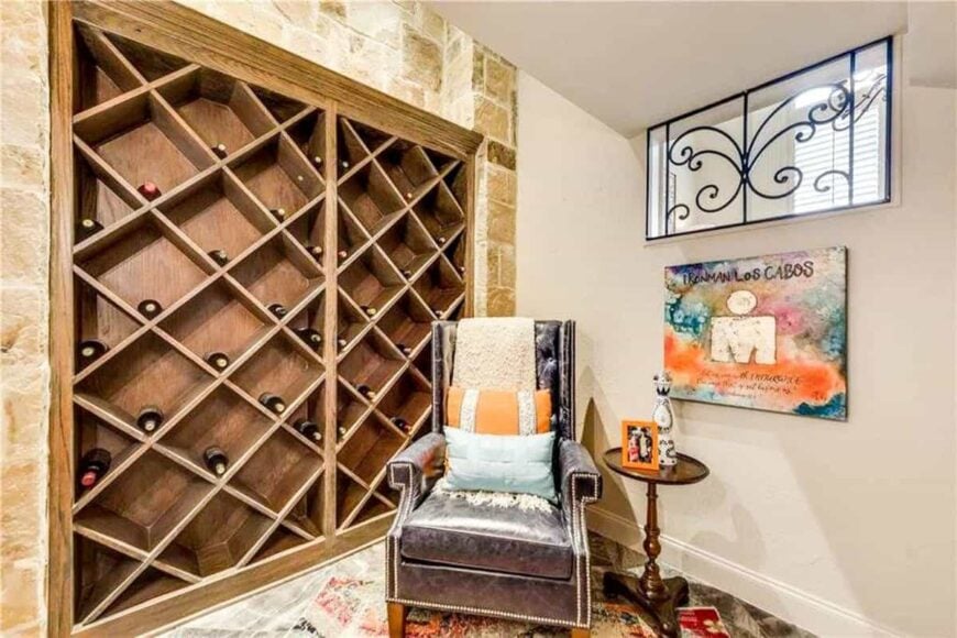 Wine storage with crisscross shelves complemented with a leather tufted chair and a round side table.