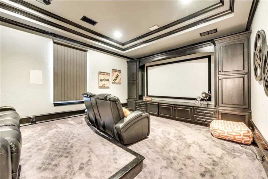 This view shows the large projector screen surrounded by built-in cabinets.