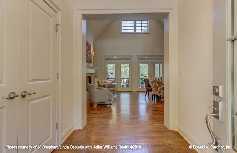 Across the foyer is the great room with cathedral ceiling and french doors.
