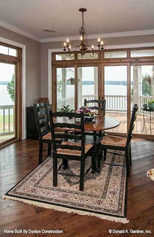 A closer look at the breakfast nook shows the screened porch accessible via the french door.