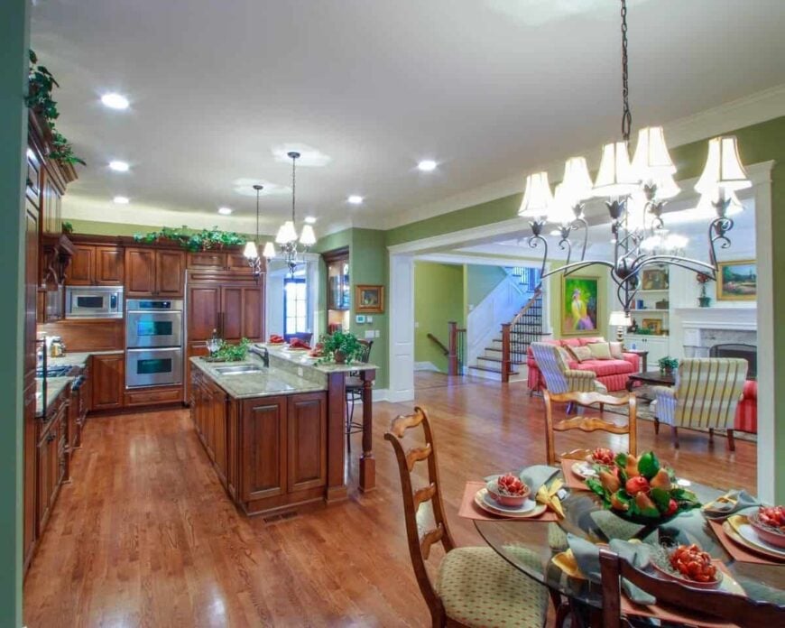 This open layout view shows the breakfast nook, kitchen, and the living room across.