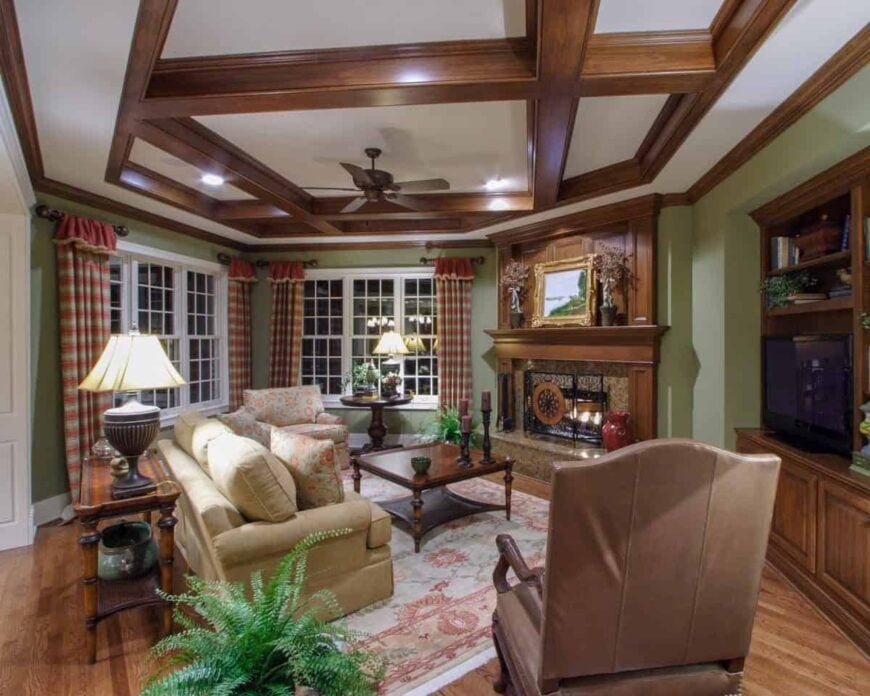 Comfy seats, dark wood tables, and a pink floral rug complete the hearth room.