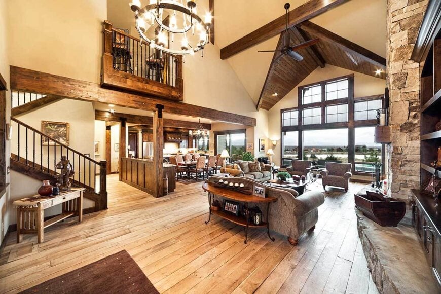 A farther view shows the high cathedral ceiling clad in dark wood planks.
