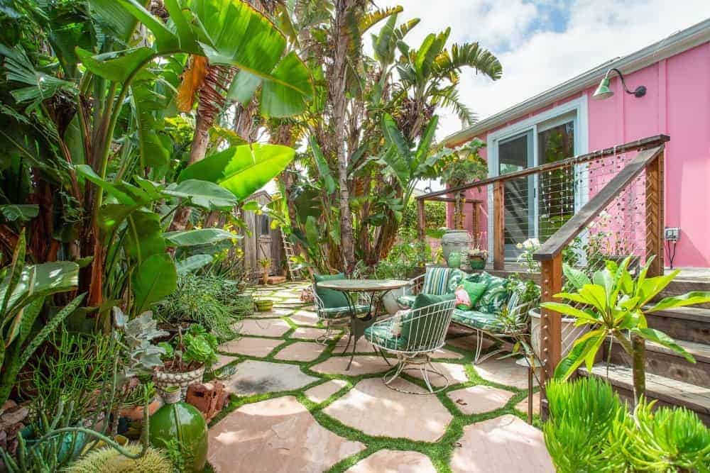 A focused look at the yard set underneath the deck, set on the ravishing walkway encompassed by the excellent garden.