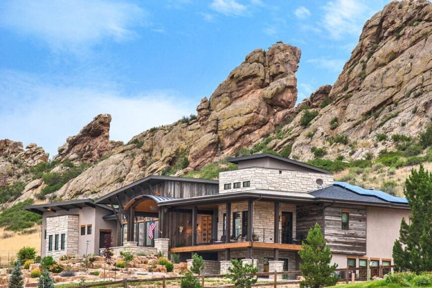 Stunning boulders create a magnificent backdrop to the modern mountain home.