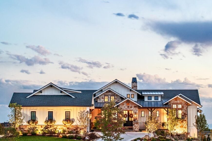 Warm, ambient light complements the new American home with a traditional facade.