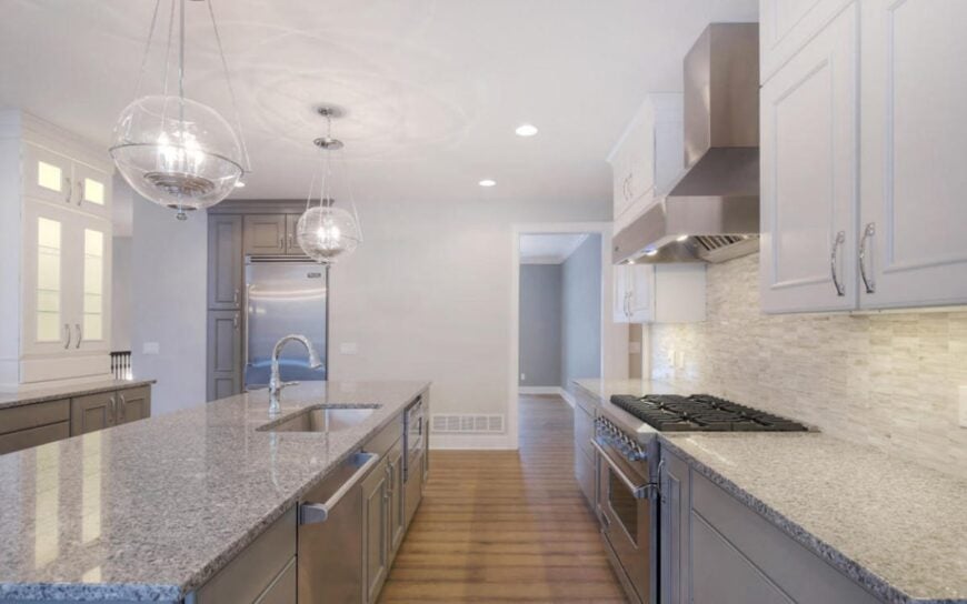 The opposite side view shows the fridge and an open doorway leading to the formal dining room.