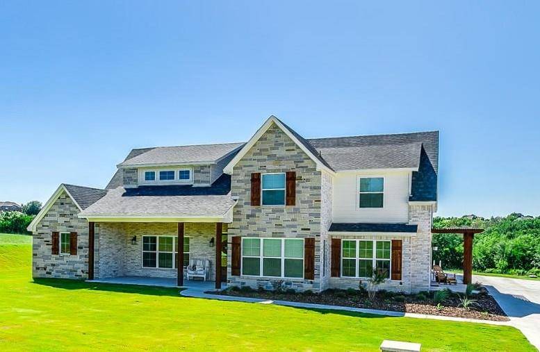 Various rooflines and gorgeous multi-colored bricks accentuate the home's exterior.